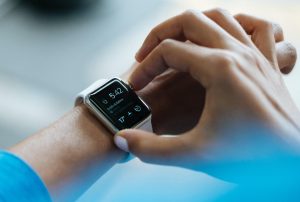 person clicking Apple Watch smartwatch